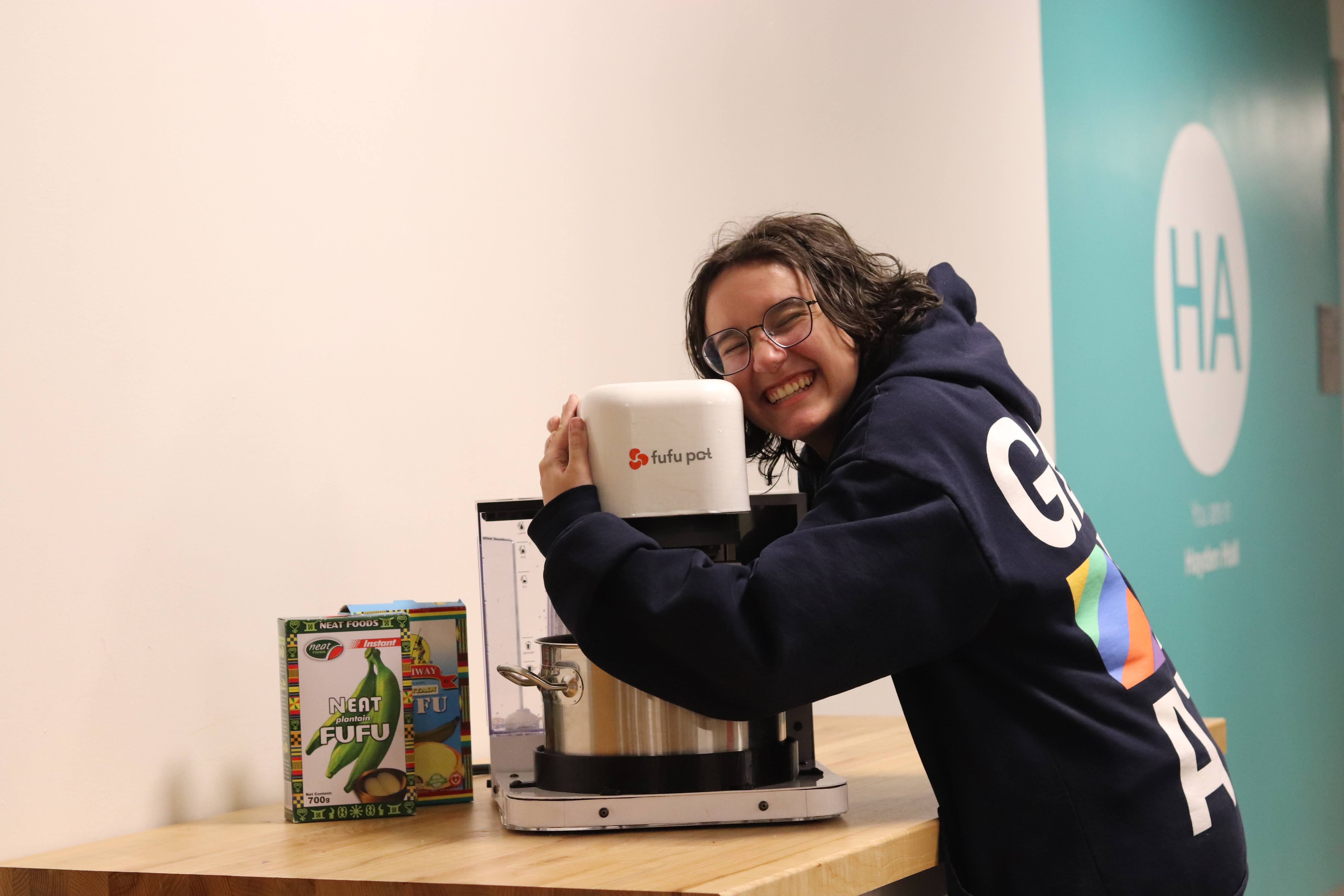 An image of Delia hugging the Fufu Pot